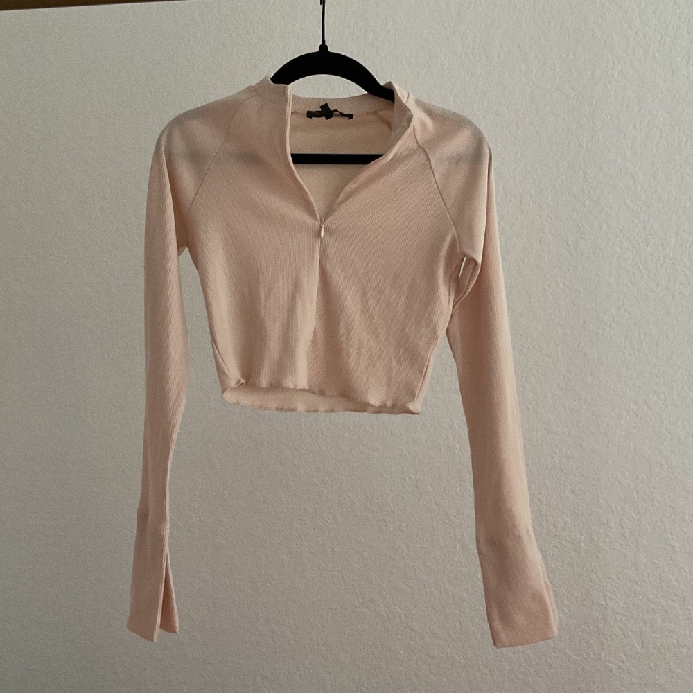 Light beige half zip long sleeve crop top